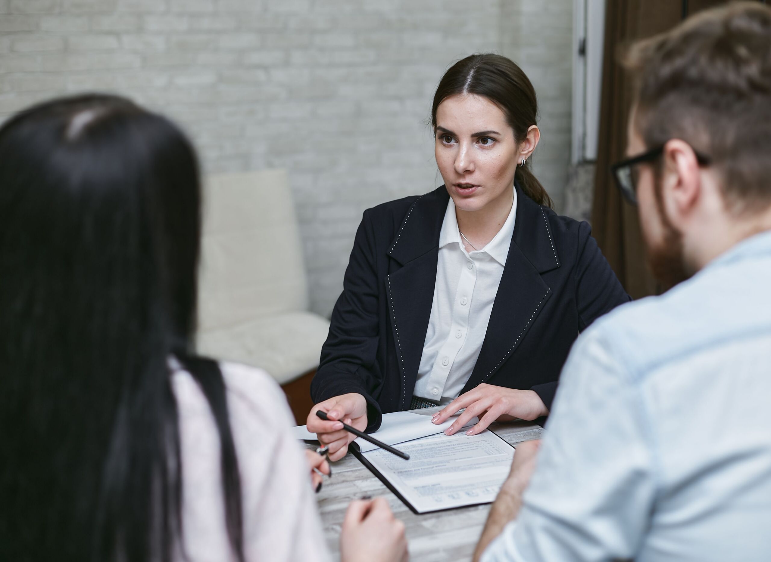 a woman talking to her co workers